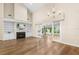 Living room with hardwood floors, fireplace and access to the kitchen at 110 Woden Way, Winter Haven, FL 33884