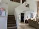 Stairs leading to the upper level with open railing at 2213 Mallory Cir, Haines City, FL 33844