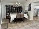 Formal dining room with built-in shelving and large table at 2213 Mallory Cir, Haines City, FL 33844