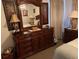 Spacious bedroom with large dresser and mirrored vanity at 2213 Mallory Cir, Haines City, FL 33844