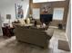 Living room with large TV and comfortable seating at 2213 Mallory Cir, Haines City, FL 33844