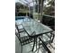 Outdoor patio furniture with glass-top table and chairs at 2213 Mallory Cir, Haines City, FL 33844