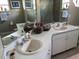 Bathroom with double sinks and large mirror at 2213 Mallory Cir, Haines City, FL 33844