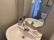 Clean bathroom with a vanity and mirror at 2213 Mallory Cir, Haines City, FL 33844