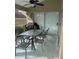 Covered patio with table and chairs, perfect for outdoor dining at 2213 Mallory Cir, Haines City, FL 33844
