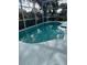 Inviting screened pool with ample deck space at 2213 Mallory Cir, Haines City, FL 33844