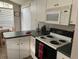 Kitchen with electric stove and microwave at 2213 Mallory Cir, Haines City, FL 33844
