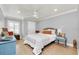 Bedroom with hardwood floors, light walls, and a ceiling fan at 514 Hillside Dr, Auburndale, FL 33823