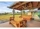 Wooden dock with two swinging benches overlooking the lake at 514 Hillside Dr, Auburndale, FL 33823