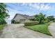 Home's exterior showcasing a garage and landscaping at 514 Hillside Dr, Auburndale, FL 33823