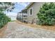 Brick walkway leading to the backyard with lake view at 514 Hillside Dr, Auburndale, FL 33823