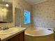 Bathroom with a garden tub and double vanity at 5490 Morgan Rd, Lakeland, FL 33810