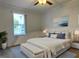 Main bedroom with white bedding and a modern feel at 5490 Morgan Rd, Lakeland, FL 33810