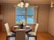 Bright dining room with round table and white chairs at 5490 Morgan Rd, Lakeland, FL 33810