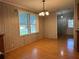 Dining room features wood floors and view into living area at 5490 Morgan Rd, Lakeland, FL 33810