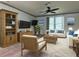 Bright living room with wood furniture and large TV at 5490 Morgan Rd, Lakeland, FL 33810