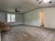 Spacious living room with carpeted floors and ceiling fan at 5490 Morgan Rd, Lakeland, FL 33810