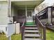 Wooden steps leading to a screened porch at 5490 Morgan Rd, Lakeland, FL 33810