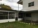 House exterior with screened porch at 34 Pine Rd, Babson Park, FL 33827