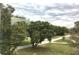 Residential street view with mature trees at 34 Pine Rd, Babson Park, FL 33827