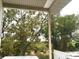 Scenic backyard view from covered porch at 34 Pine Rd, Babson Park, FL 33827