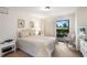Bedroom with a queen-size bed and access to the patio at 2070/2071 Corner Lake Dr # 2, Haines City, FL 33844