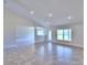 Bright and airy living room with tile floors and high ceilings at 4024 Tullamore Ln, Auburndale, FL 33823