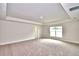 Spacious main bedroom with carpeted floor and large window at 4024 Tullamore Ln, Auburndale, FL 33823