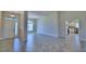 Bright and spacious entryway with tile flooring and open floor plan at 4024 Tullamore Ln, Auburndale, FL 33823