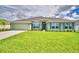 One-story house with green exterior and landscaping at 4024 Tullamore Ln, Auburndale, FL 33823