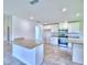 Modern kitchen featuring island, stainless steel appliances, and granite countertops at 4024 Tullamore Ln, Auburndale, FL 33823