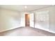 Well-lit bedroom with double door closet and access to bathroom at 4024 Tullamore Ln, Auburndale, FL 33823