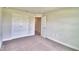 Spacious bedroom with double doors to closet and carpet at 4024 Tullamore Ln, Auburndale, FL 33823