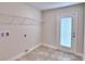 Laundry room with exterior access and tile flooring at 4024 Tullamore Ln, Auburndale, FL 33823