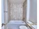 Bathroom with tub, shower, and tile surround at 4024 Tullamore Ln, Auburndale, FL 33823