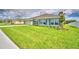 One-story house with green exterior and landscaping at 4024 Tullamore Ln, Auburndale, FL 33823