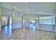 Open concept living room with kitchen and dining room views at 4024 Tullamore Ln, Auburndale, FL 33823