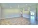 Spacious living room with tile floors and vaulted ceilings at 4024 Tullamore Ln, Auburndale, FL 33823