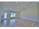 Large Gathering room with tile floors and access to backyard at 4024 Tullamore Ln, Auburndale, FL 33823