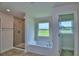 Main bathroom with soaking tub, shower, and double vanity at 4024 Tullamore Ln, Auburndale, FL 33823