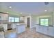 Spacious kitchen with island, white cabinets, and ample counter space at 4024 Tullamore Ln, Auburndale, FL 33823