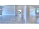 Open dining room with tile floors and view of kitchen at 4024 Tullamore Ln, Auburndale, FL 33823