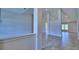 Open living room with tile floors and high ceilings at 4024 Tullamore Ln, Auburndale, FL 33823