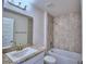 Clean bathroom with single vanity, shower/tub combo, and tile surround at 4024 Tullamore Ln, Auburndale, FL 33823