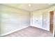 Spacious bedroom with double doors to closet and carpet at 4024 Tullamore Ln, Auburndale, FL 33823