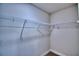 Walk-in closet with wire shelving and hanging rods at 4024 Tullamore Ln, Auburndale, FL 33823