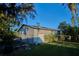 Large metal workshop with open roll-up door at 3860 E Gaskins Rd, Bartow, FL 33830