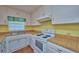 Kitchen with white cabinets, tiled floors, and stove at 3860 E Gaskins Rd, Bartow, FL 33830