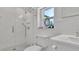 Elegant bathroom with a frameless glass shower and hexagon tile at 2300 N Scenic Hwy # 7, Lake Wales, FL 33898