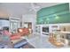 Bright living room featuring comfortable seating and a built-in entertainment center at 132 Lake Region Cir, Winter Haven, FL 33881